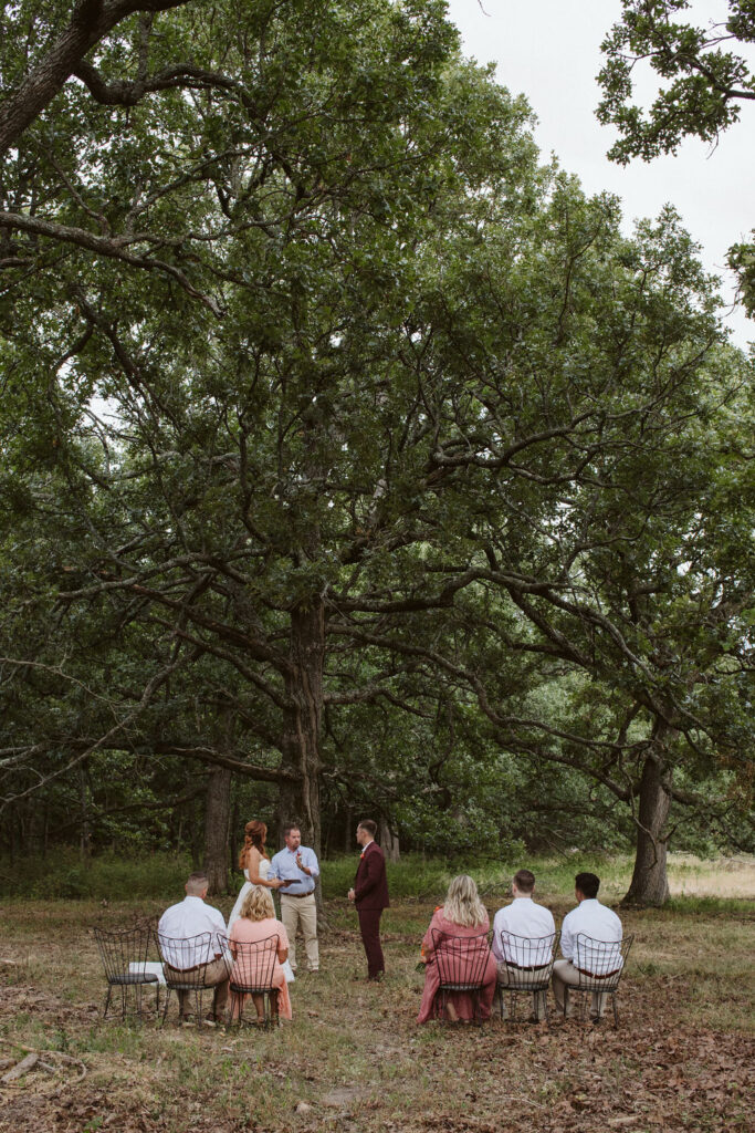 private outdoor ceremony under the large oaks