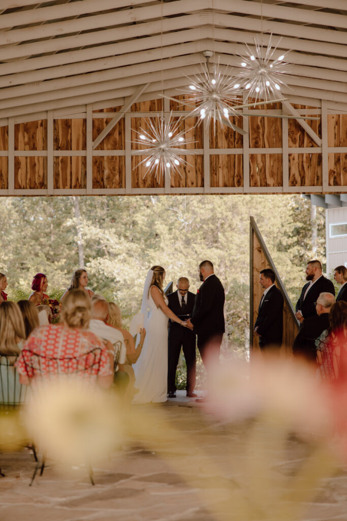 outdoor wedding under shade of pavilion